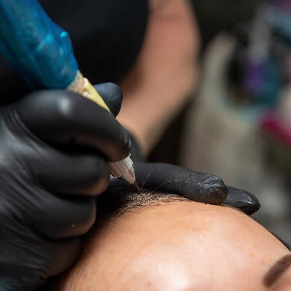 Close-up of female smp treatment adding natural fullness to thinning hair at mc scalp in hemel hempstead